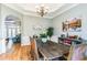 Charming dining room with hardwood floors, chandelier, and painting at 6740 Mountain Lake Ln, Cumming, GA 30028
