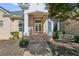 Charming brick home with a covered front porch and manicured landscaping at 6740 Mountain Lake Ln, Cumming, GA 30028