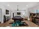 Spacious game room with a pool table, arcade games, and stylish lighting at 6740 Mountain Lake Ln, Cumming, GA 30028