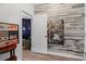 Hallway leading to a music room, featuring wood paneling and a framed photograph at 6740 Mountain Lake Ln, Cumming, GA 30028