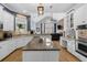 Well-lit kitchen featuring granite countertops, a center island, and stainless steel appliances at 6740 Mountain Lake Ln, Cumming, GA 30028