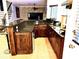 Gourmet kitchen with stainless steel appliances, granite countertops, and custom cabinetry at 6740 Mountain Lake Ln, Cumming, GA 30028
