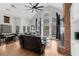 Comfortable living room featuring a brick fireplace, vaulted ceiling, and lots of natural light at 6740 Mountain Lake Ln, Cumming, GA 30028