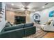Comfortable living room area with hardwood floors, brick accent wall and recessed lighting at 6740 Mountain Lake Ln, Cumming, GA 30028
