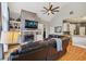Inviting living room with a brick fireplace, built-in shelving, and vaulted ceilings at 6740 Mountain Lake Ln, Cumming, GA 30028