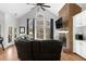 Inviting living room with a vaulted ceiling, brick fireplace, and lots of natural light at 6740 Mountain Lake Ln, Cumming, GA 30028