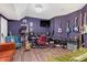 Unique music room featuring purple walls and a variety of guitars, instruments, and recording equipment at 6740 Mountain Lake Ln, Cumming, GA 30028