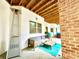 Covered patio with comfortable seating, modern lighting, and cozy atmosphere at 6740 Mountain Lake Ln, Cumming, GA 30028