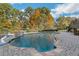 Beautiful backyard pool with a waterfall feature and spacious patio area at 6740 Mountain Lake Ln, Cumming, GA 30028
