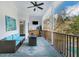 Inviting porch features a ceiling fan, comfortable seating, and an outdoor rug at 6740 Mountain Lake Ln, Cumming, GA 30028
