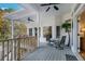 Spacious porch with ceiling fans, comfortable seating, and scenic views at 6740 Mountain Lake Ln, Cumming, GA 30028