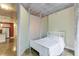 Bedroom with bed separated from other living area by walls with concrete ceilings and flooring at 845 Spring Nw St # 127, Atlanta, GA 30308