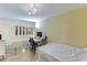 A sunlit bedroom is staged with a work-from-home desk and minimalist decor at 845 Spring Nw St # 127, Atlanta, GA 30308