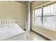 Bright bedroom featuring large windows offering abundant natural light and concrete support column at 845 Spring Nw St # 127, Atlanta, GA 30308