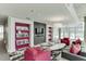 Spacious living room features a stylish gray sofa, purple accents and a modern design at 845 Spring Nw St # 127, Atlanta, GA 30308