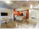 Open living area boasts concrete floors, modern kitchen, stainless appliances, and dining area at 845 Spring Nw St # 127, Atlanta, GA 30308