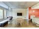 Bright living area featuring concrete floors, large windows, a dining area, and an adjacent kitchen at 845 Spring Nw St # 127, Atlanta, GA 30308