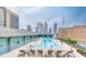 Rooftop pool area with lounge chairs offers a relaxing oasis with city views at 845 Spring Nw St # 127, Atlanta, GA 30308