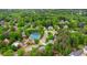 Overhead neighborhood view with homes, mature trees, and tennis courts at 10490 Cranchester Way, Alpharetta, GA 30022