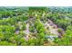 A bird's eye view of a neighborhood with mature trees at 10490 Cranchester Way, Alpharetta, GA 30022