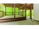 Covered back porch overlooking a serene, wooded area at 10490 Cranchester Way, Alpharetta, GA 30022