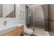 Modern bathroom features a floating vanity, vessel sink, sleek fixtures, and glass enclosed shower at 10490 Cranchester Way, Alpharetta, GA 30022