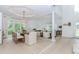 Open dining area featuring hardwood floors and modern chairs, fixture and accents at 10490 Cranchester Way, Alpharetta, GA 30022