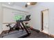 Dedicated home gym with fitness equipment and natural light, creating an ideal workout space at 10490 Cranchester Way, Alpharetta, GA 30022