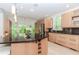 Well-equipped kitchen boasts a large island, modern stainless steel appliances, and ample counter space at 10490 Cranchester Way, Alpharetta, GA 30022