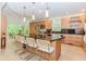 Well-equipped kitchen boasts a large island, modern stainless steel appliances, and ample counter space at 10490 Cranchester Way, Alpharetta, GA 30022