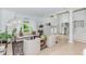 Bright living room with hardwood floors, large windows, and neutral decor provides a warm atmosphere at 10490 Cranchester Way, Alpharetta, GA 30022