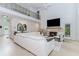 Upstairs living room with fireplace and balcony overlooking lower level and wooded views at 10490 Cranchester Way, Alpharetta, GA 30022