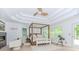 Spacious main bedroom with tray ceilings, fireplace, and scenic views at 10490 Cranchester Way, Alpharetta, GA 30022