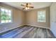 Bedroom with natural light, ceiling fan, and a double closet at 14721 Highway 36, Covington, GA 30014