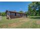 Charming brick home with well-maintained lawn and inviting porch at 14721 Highway 36, Covington, GA 30014