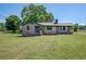Charming brick home with a neatly manicured lawn and blooming flowerbeds, offering a warm and inviting curb appeal at 14721 Highway 36, Covington, GA 30014