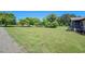 Expansive front yard with lush green grass and mature trees at 14721 Highway 36, Covington, GA 30014