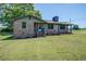 Charming brick home with a neatly manicured lawn and blooming flowerbeds, offering a warm and inviting curb appeal at 14721 Highway 36, Covington, GA 30014