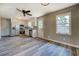 Bright kitchen with stainless steel appliances, light wood cabinets, and wood-style flooring at 14721 Highway 36, Covington, GA 30014