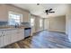 A bright kitchen features stainless appliances, wood-look floors and a garden window at 14721 Highway 36, Covington, GA 30014