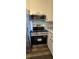 Stainless steel oven and microwave in kitchen with white cabinets at 14721 Highway 36, Covington, GA 30014