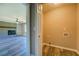 View from the laundry room shows the spacious living room with a fireplace and wood-look flooring at 14721 Highway 36, Covington, GA 30014