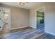 Open concept living room with wood-look flooring is adjacent to the bathroom and fireplace at 14721 Highway 36, Covington, GA 30014