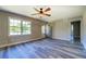 Bright living room features wood-look flooring and plenty of natural light at 14721 Highway 36, Covington, GA 30014