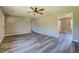 Open concept living room with wood-look flooring is spacious and bright at 14721 Highway 36, Covington, GA 30014
