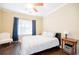 Bedroom with a ceiling fan, a side chair, a side table and a closet at 2114 Woodland Ln, Alpharetta, GA 30009