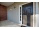 Welcoming front door with sidelight window, modern lock and brick accents providing a secure and stylish entrance at 2114 Woodland Ln, Alpharetta, GA 30009