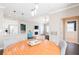 Open concept living room features a fireplace, dark floors, and access to a balcony at 2114 Woodland Ln, Alpharetta, GA 30009