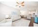 Open-concept living room with hardwood floors, seamlessly connecting to the dining area and kitchen for easy entertaining at 2114 Woodland Ln, Alpharetta, GA 30009