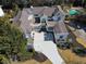 Aerial view of a modern home with a large driveway and a swimming pool at 255 Northland Ridge Trl, Atlanta, GA 30342